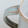 close up of blue mug handle