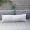 Stripey cushion on a grey outdoor sofa 