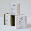 Stack of Boxes in grey, pale pink and forest green for Aerende non-toxic Candles