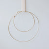 Two hand-hammered brass hoop rings