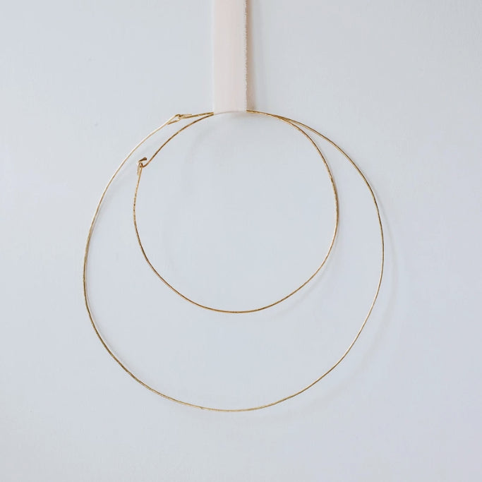 Two hand-hammered brass hoop rings