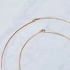 Close up of Aerende brass hoops with loop closure