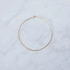 A simple brass hoop on a marble background
