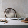 Handmade kitchenware on a rustic dining table