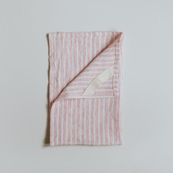 Pink stripe linen tea towel, handmade by refugees in the UK