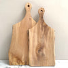 Two wooden chopping board handles with holes