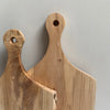 Two wooden chopping board handles with holes